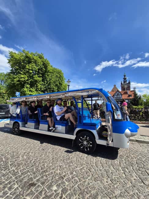 Gdansk:UNLIMITED beer incl. City Tour By Golf Cart - Big Squares and Transportation Landmarks: Solidarity Square and the Railway Station