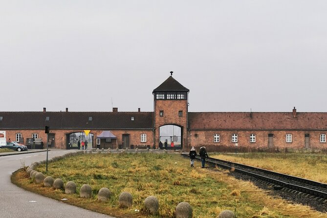 Guided Tour from Krakow to Auschwitz Birkenau with hotel pick up - Auschwitz I: The gate, the last surviving gas chamber, and the story on foot
