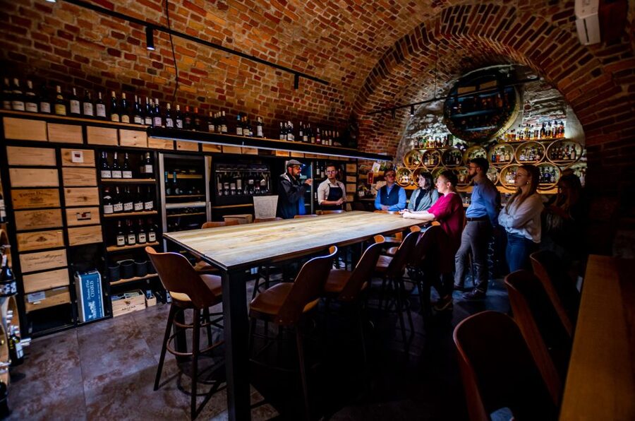 Krakow: Guided Wine Bar Tour with Tastings and Snacks - Stop One in Old Town: your first Polish pour with cheese and charcuterie