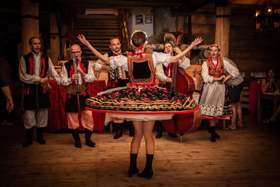 Krakow: Polish Folk Night with Dinner and Unlimited Drinks - Dinner details: pierogi, meats, fresh bread, and what all-you-can-eat can look like