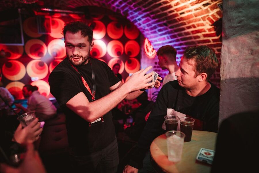 Krakow: Pub Crawl with 1 Hour of Unlimited Alcoholic Drinks - Drinking Games: Flip Cup, Beer Pong, and Flip Coin