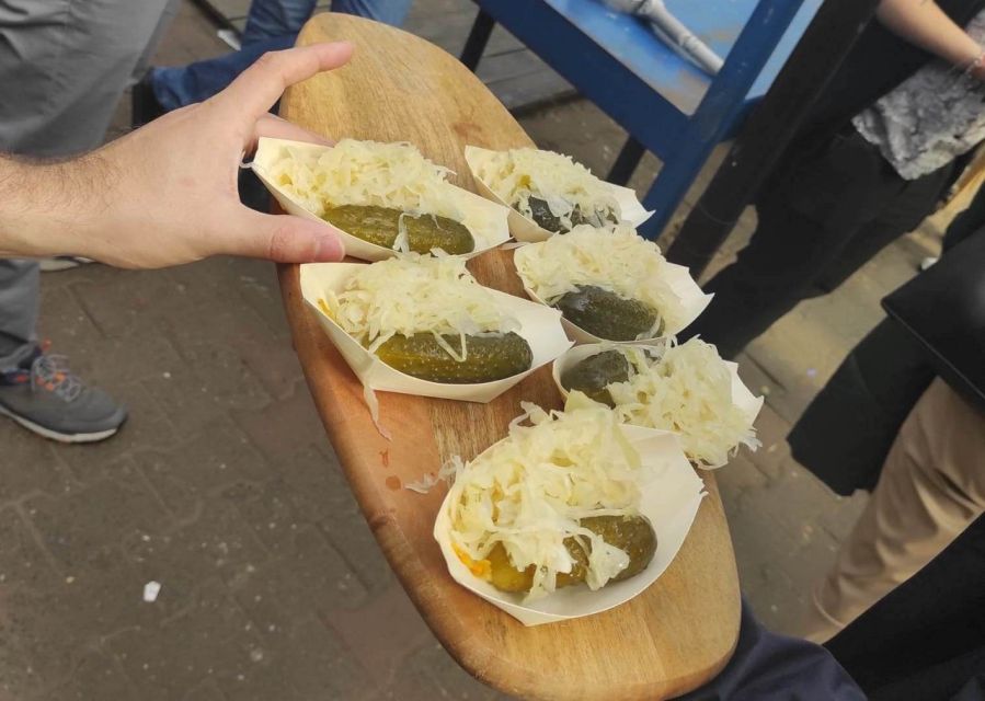 Krakow: Traditional Street Food Walking Tour - Cheese, pickles, sausage, sweets, and the vodka shot