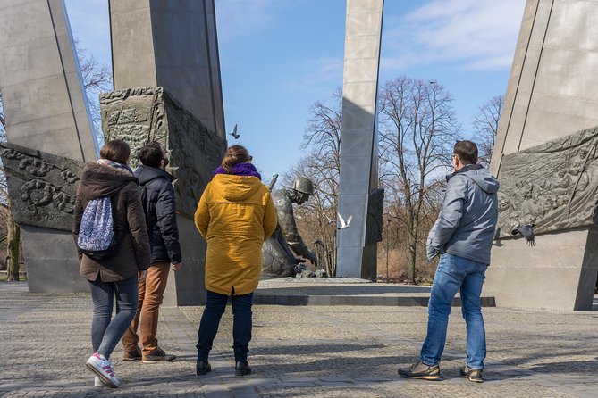 Warsaw: Communism Tour in an Original Socialist Van - Constitution Square and MDM: ideology mapped onto apartments