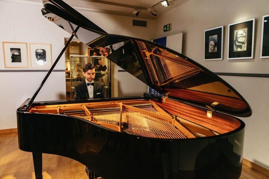 Warsaw: Live Chopin Piano Concert - The performers and the audience vibe in a small hall